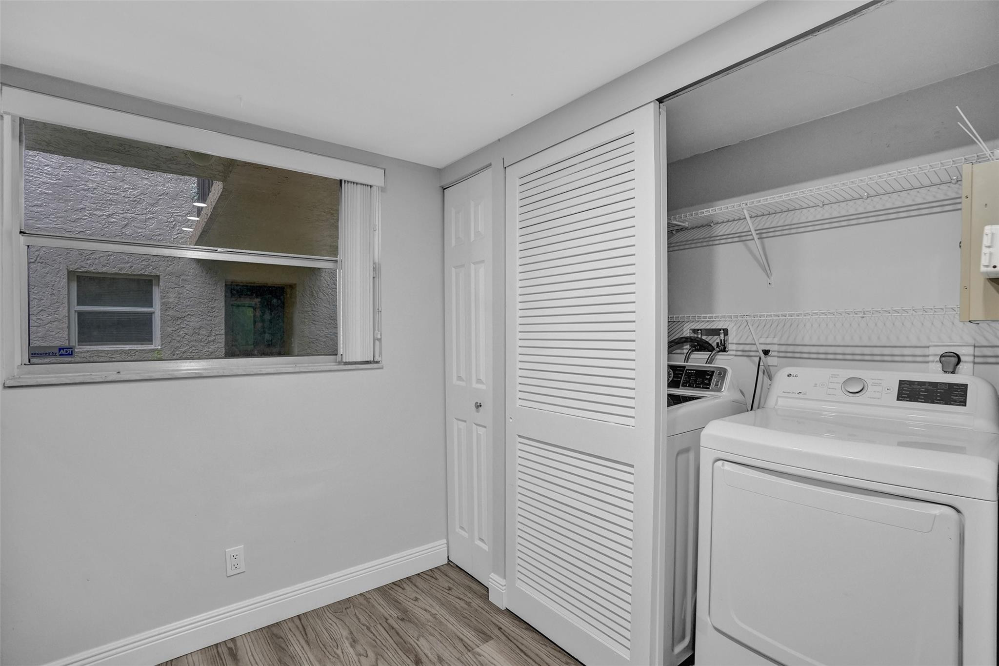 3100 Riverside Drive, Unit 109 Coral Springs, FL 33065 - Photo 4 of 28 a utility room with dryer and washer