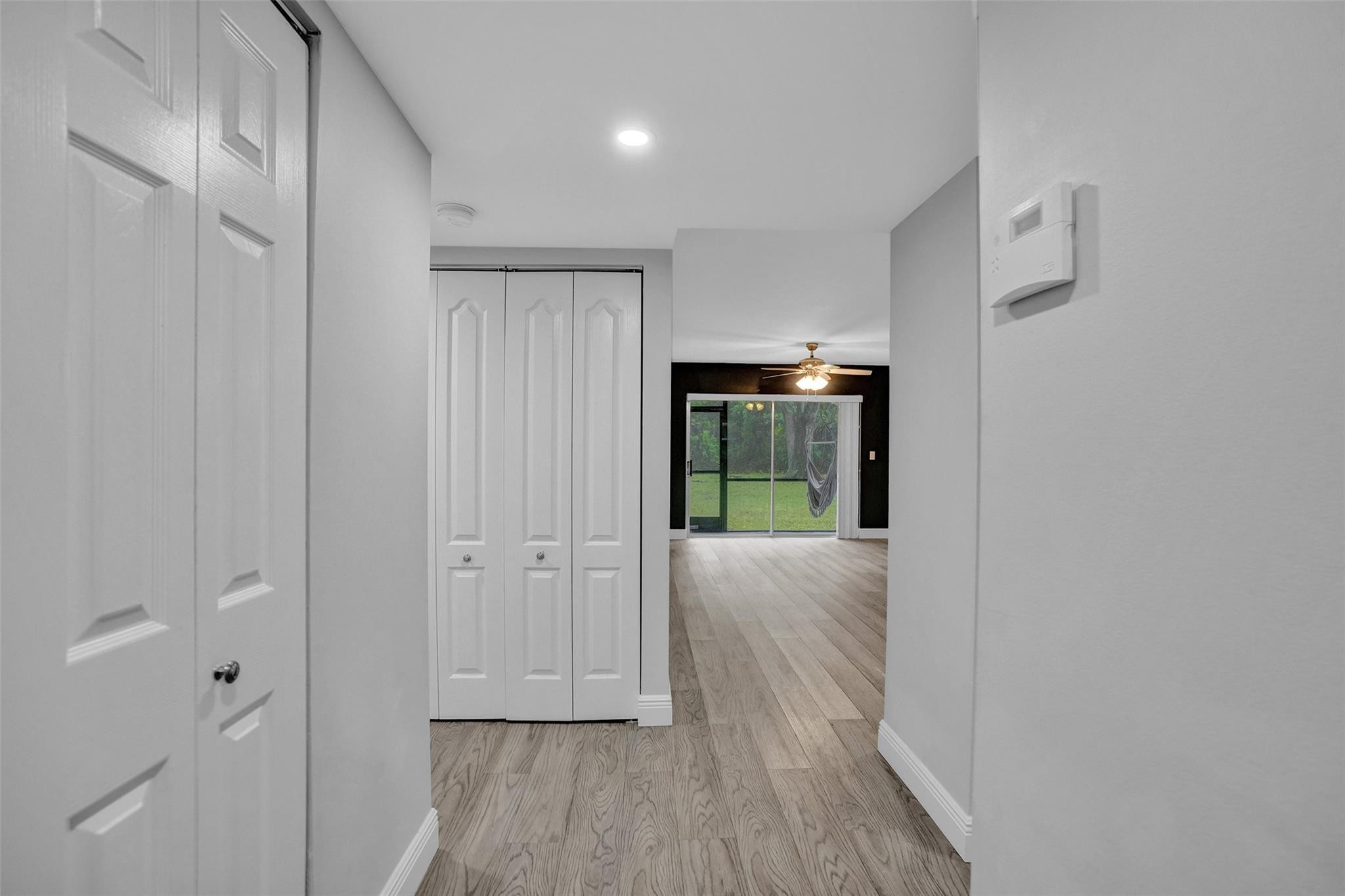 3100 Riverside Drive, Unit 109 Coral Springs, FL 33065 - Photo 6 of 28 a view of hallway with closet and wooden floor