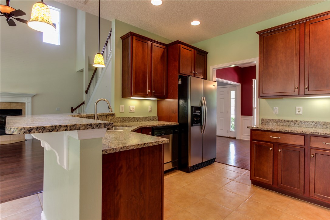 2965 Pinedale Road Fernandina Beach, FL 32034 - Photo 13 of 35 a kitchen with stainless steel appliances granite countertop a refrigerator and a sink