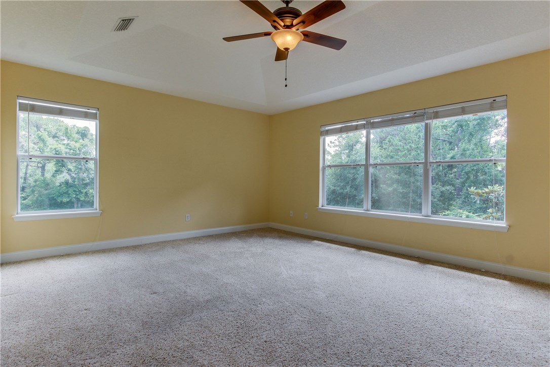 2965 Pinedale Road Fernandina Beach, FL 32034 - Photo 15 of 35 an empty room with a window and a ceiling fan