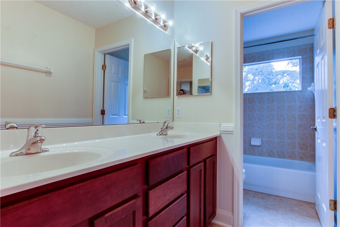 2965 Pinedale Road Fernandina Beach, FL 32034 - Photo 22 of 35 a bathroom with a tub a sink and mirror