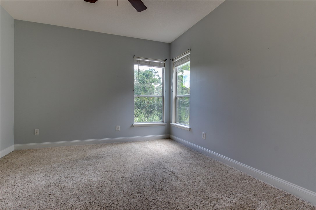 2965 Pinedale Road Fernandina Beach, FL 32034 - Photo 25 of 35 an empty room with windows and closet