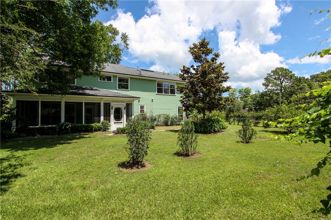 2965 Pinedale Road Fernandina Beach, FL 32034 - Photo 33 of 35 a view of a house with a yard and sitting area
