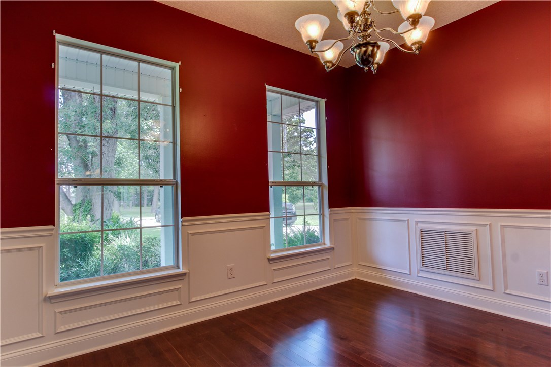 2965 Pinedale Road Fernandina Beach, FL 32034 - Photo 4 of 35 a view of an empty room with wooden floor and a window