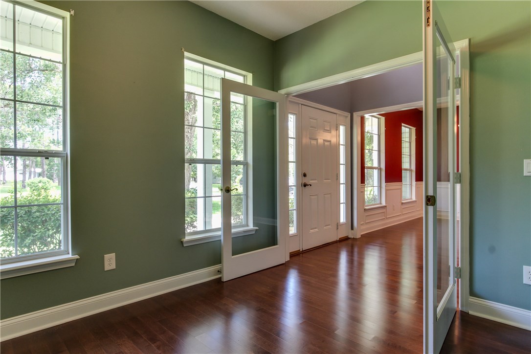2965 Pinedale Road Fernandina Beach, FL 32034 - Photo 5 of 35 a view of empty room with wooden floor and fan