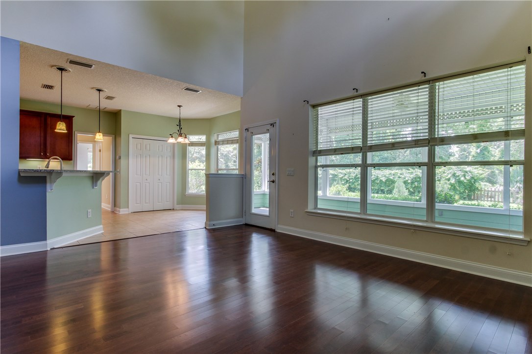 2965 Pinedale Road Fernandina Beach, FL 32034 - Photo 8 of 35 an empty room with wooden floor and windows