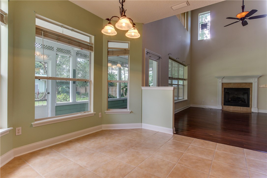 2965 Pinedale Road Fernandina Beach, FL 32034 - Photo 10 of 35 an empty room with chandelier and windows