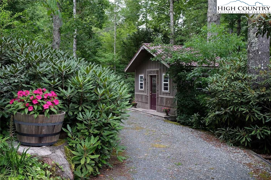 203 Black Pine Road Newland, NC 28657 - Photo 14 of 39 a view of a house with a flower garden