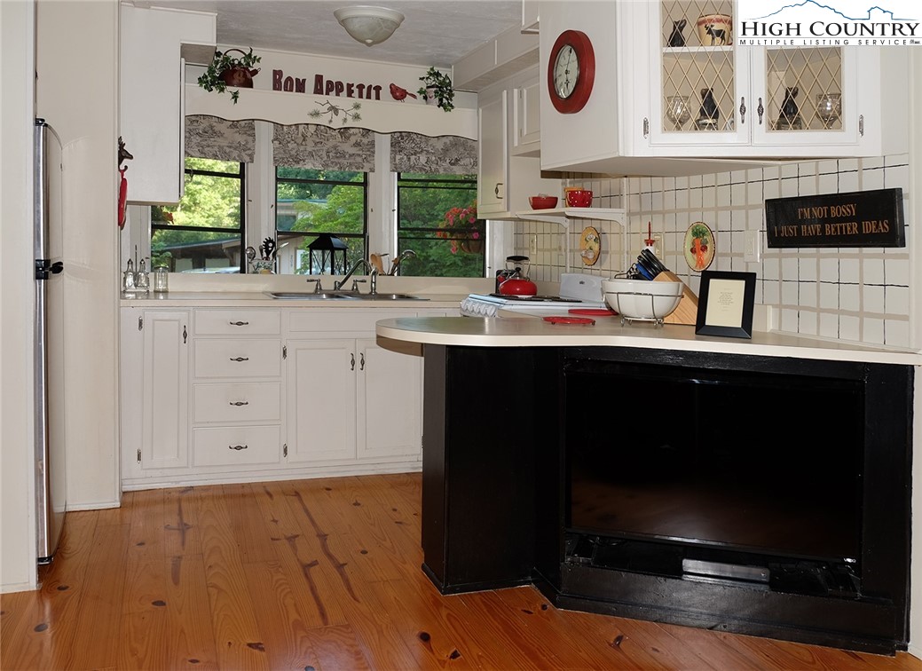 203 Black Pine Road Newland, NC 28657 - Photo 2 of 39 a kitchen with stainless steel appliances a sink and cabinets