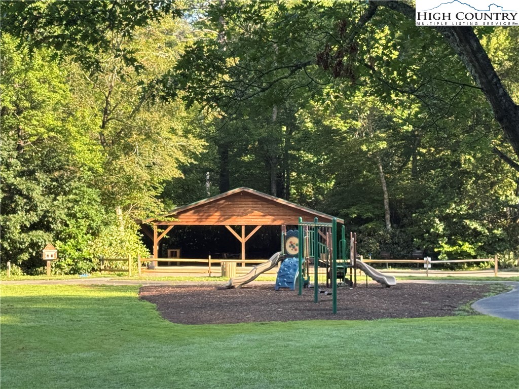 203 Black Pine Road Newland, NC 28657 - Photo 24 of 39 a house view with swimming pool and garden space