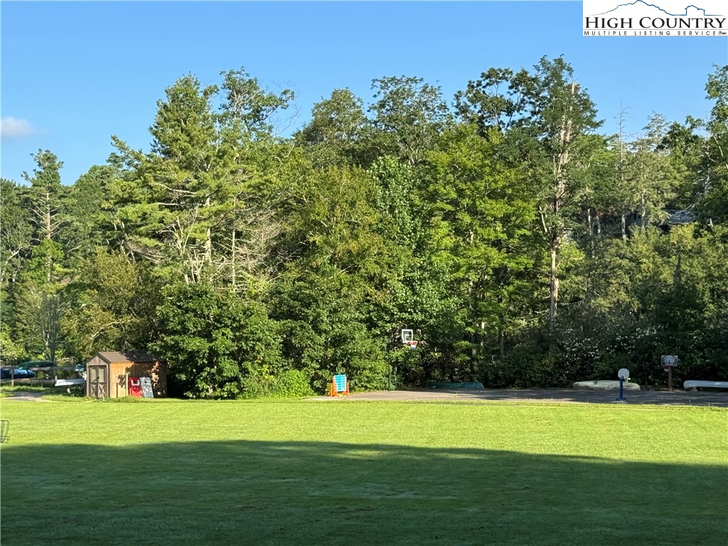 203 Black Pine Road Newland, NC 28657 - Photo 27 of 39 a view of a golf course with a lake
