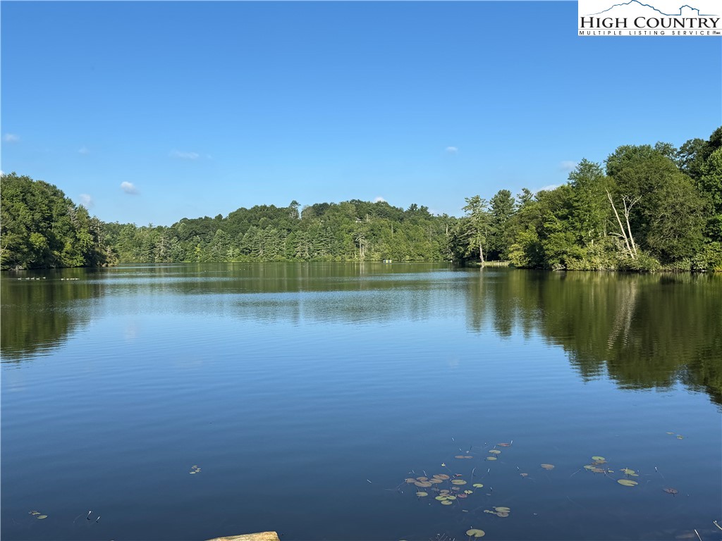 203 Black Pine Road Newland, NC 28657 - Photo 31 of 39 a view of a lake with houses in the background