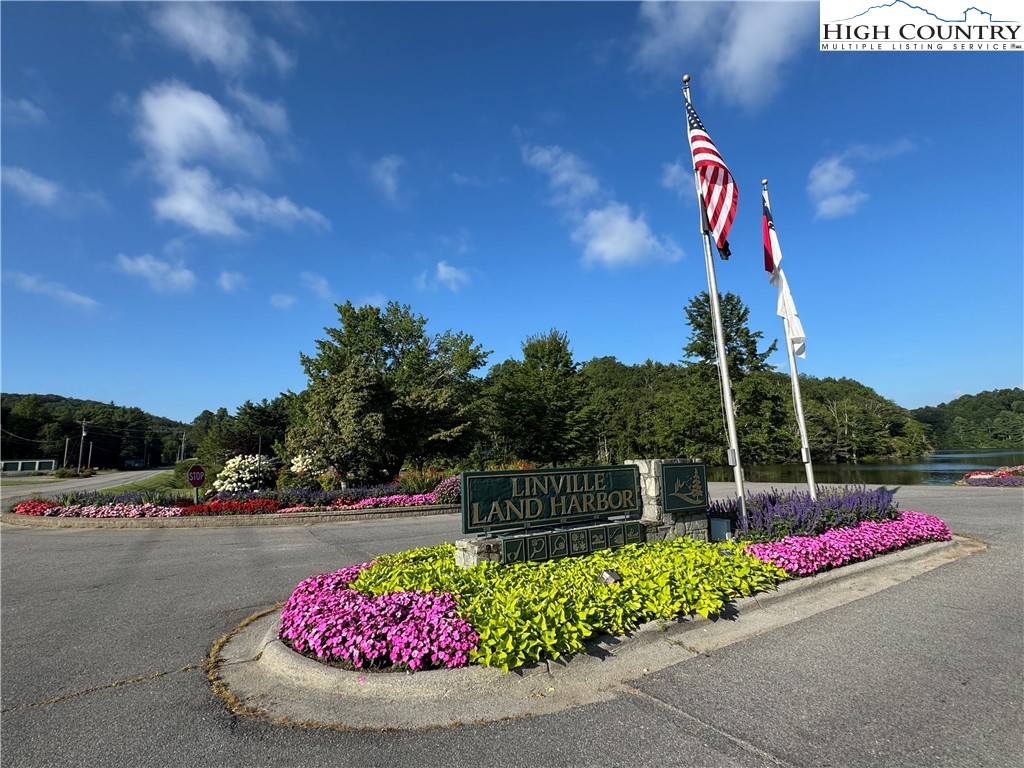 203 Black Pine Road Newland, NC 28657 - Photo 39 of 39 a park view with a bench in front of house