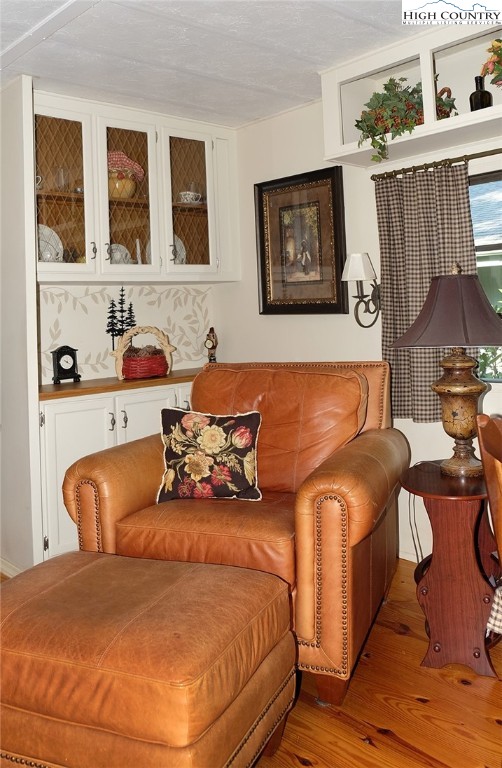 203 Black Pine Road Newland, NC 28657 - Photo 5 of 39 a bed sitting in a bedroom next to a window with painting on wall