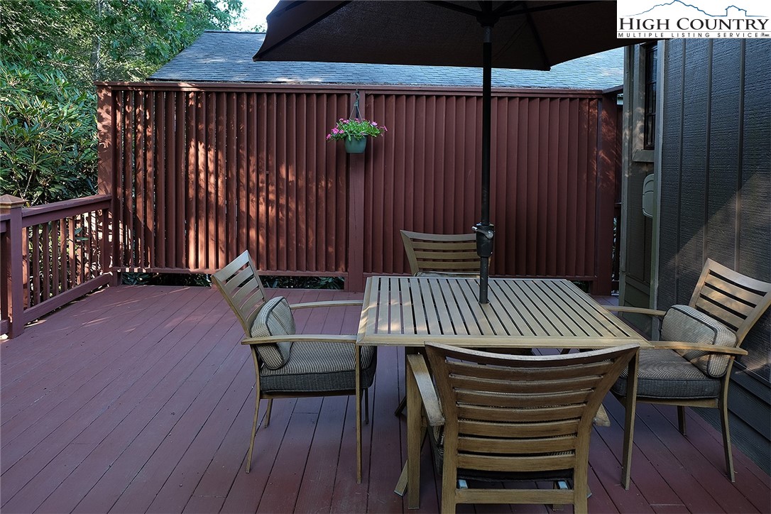 203 Black Pine Road Newland, NC 28657 - Photo 10 of 39 a view of balcony with wooden floor and outdoor seating