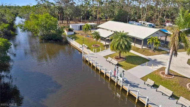 an aerial view of a house with outdoor space and lake view