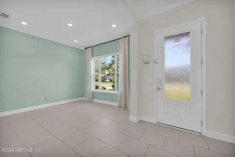 a large kitchen with stainless steel appliances kitchen island granite countertop a sink a counter top space and cabinets