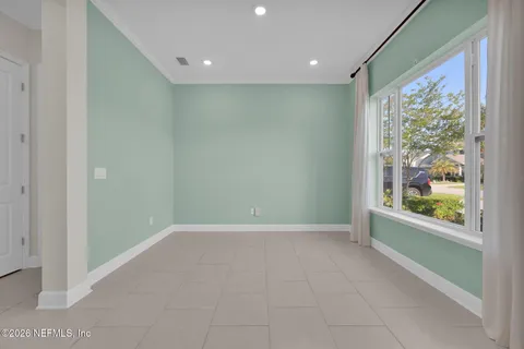 a kitchen with kitchen island granite countertop a sink a refrigerator and a stove