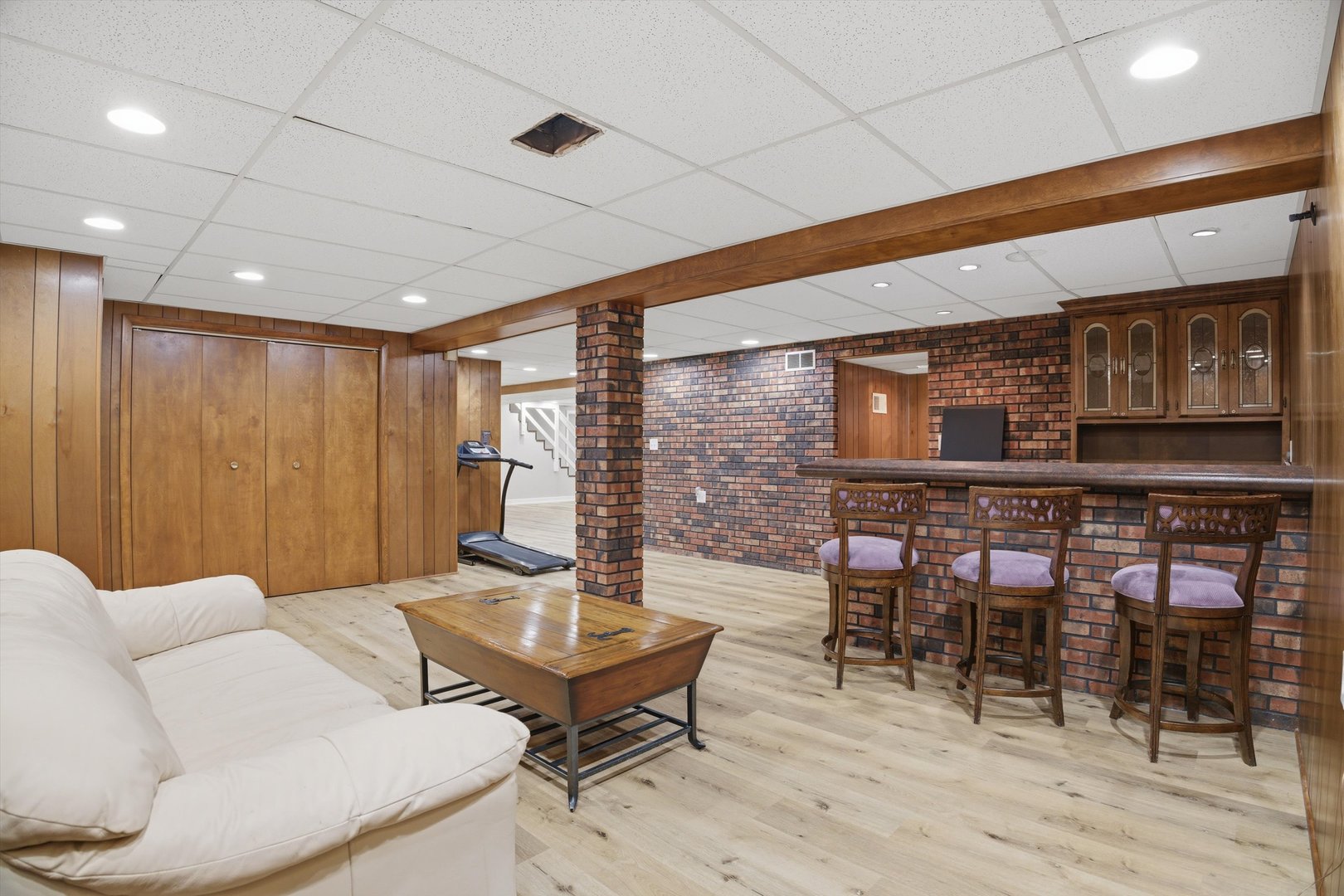 25 Devonshire Circle Elgin, IL 60123 - Photo 20 of 31 a living room with furniture a flat screen tv and kitchen view