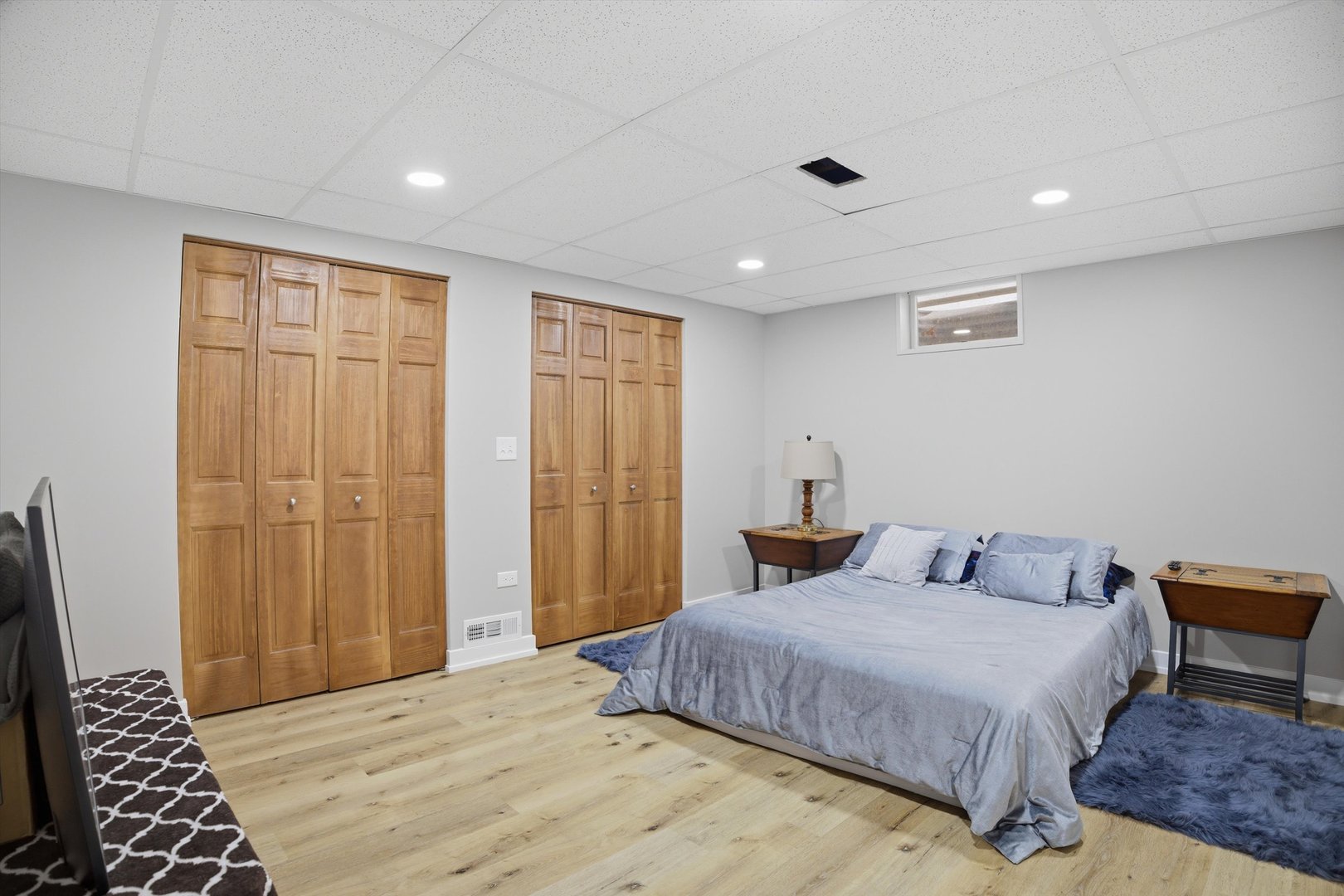 25 Devonshire Circle Elgin, IL 60123 - Photo 22 of 31 a bedroom with a large bed and a chandelier