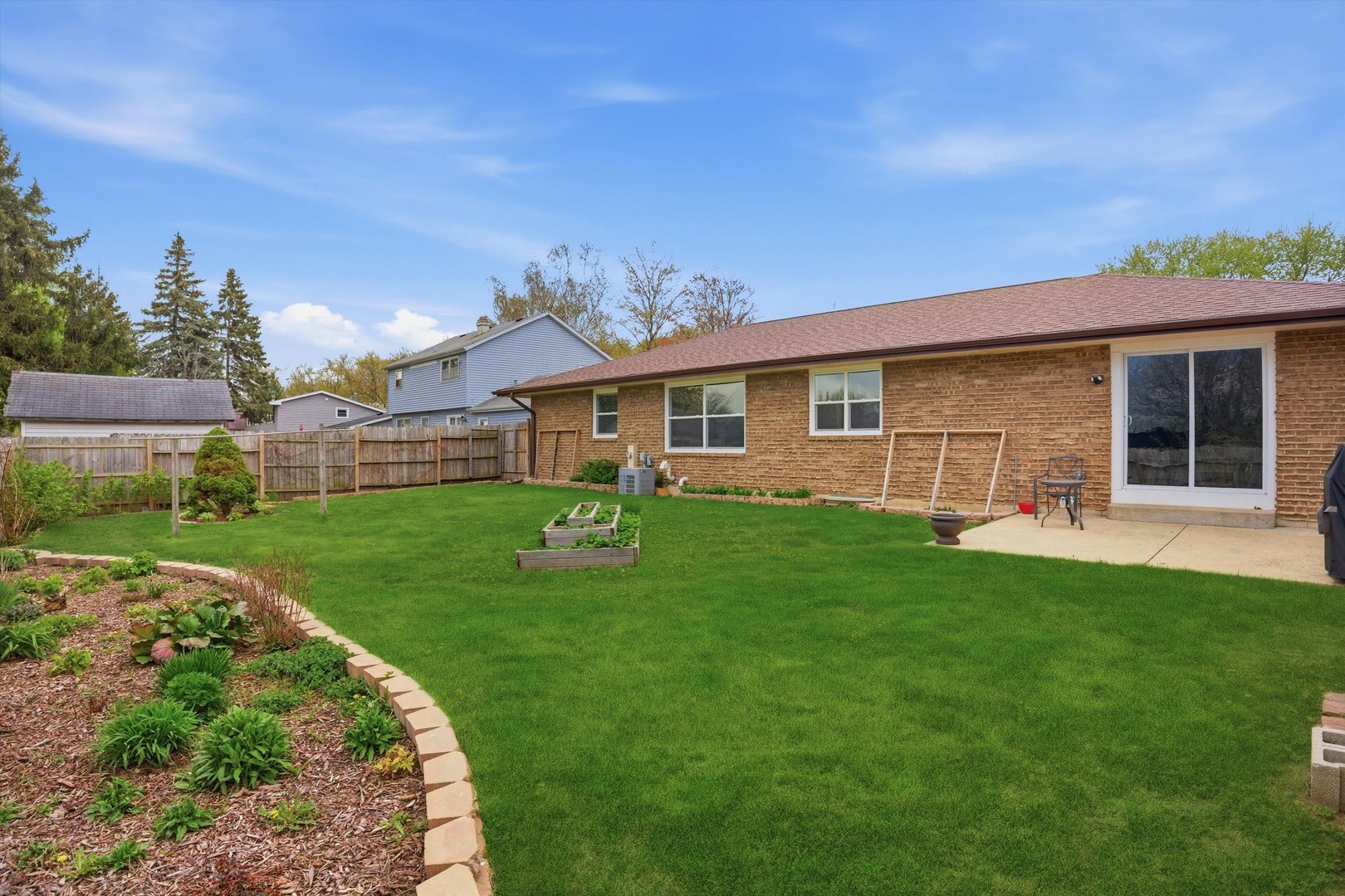25 Devonshire Circle Elgin, IL 60123 - Photo 25 of 31 a front view of a house with a garden