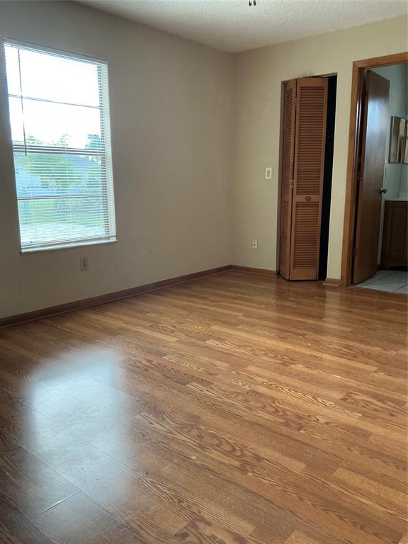 1858 Southwest Capehart Avenue Port St. Lucie, FL 34953 - Photo 4 of 11 an empty room with windows and closet