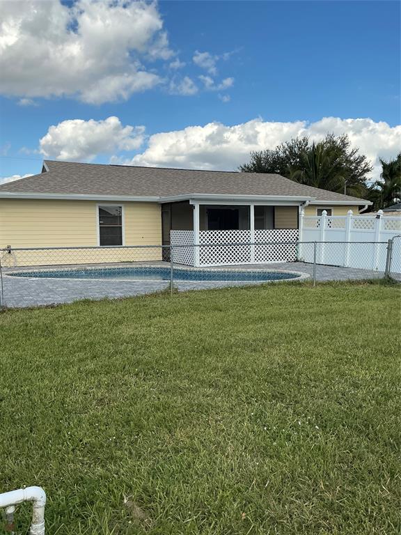 1858 Southwest Capehart Avenue Port St. Lucie, FL 34953 - Photo 8 of 11 a view of a house with a yard