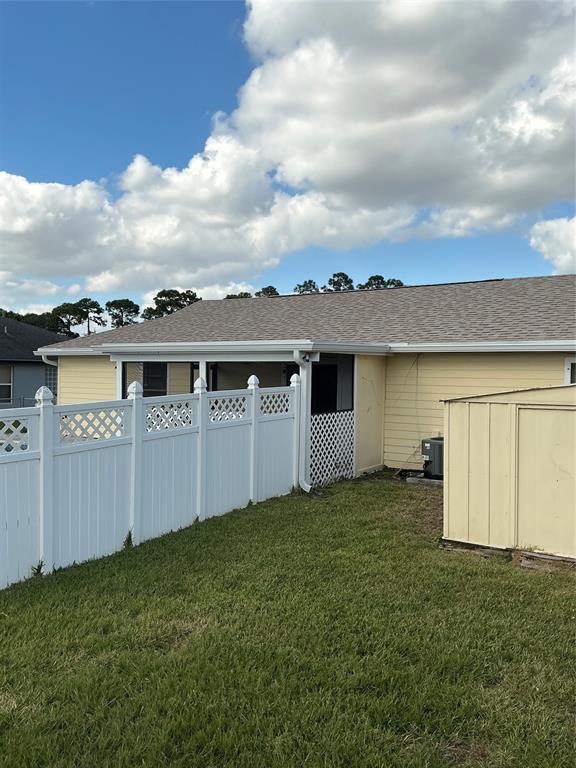 1858 Southwest Capehart Avenue Port St. Lucie, FL 34953 - Photo 9 of 11 an outdoor view of house with backyard