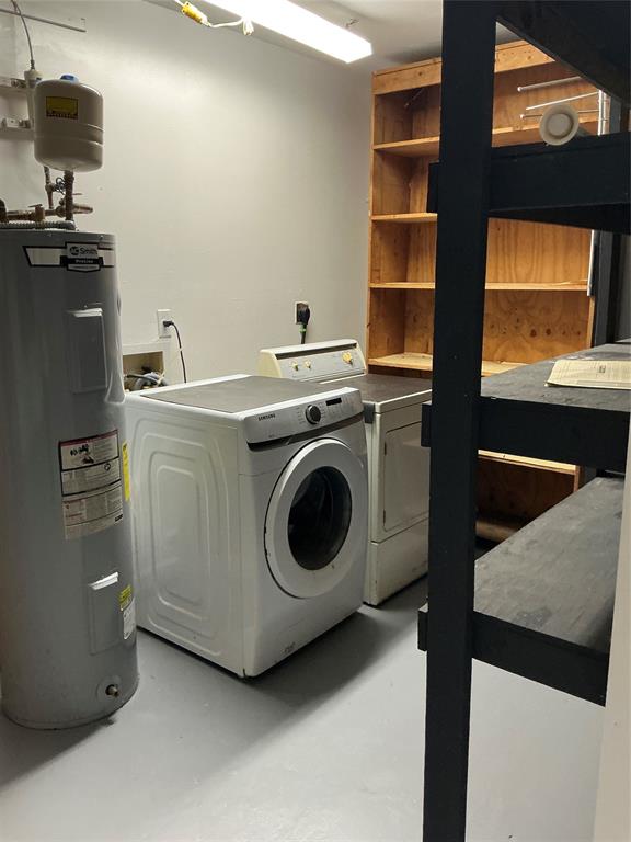 1858 Southwest Capehart Avenue Port St. Lucie, FL 34953 - Photo 10 of 11 a utility room with dryer and washer
