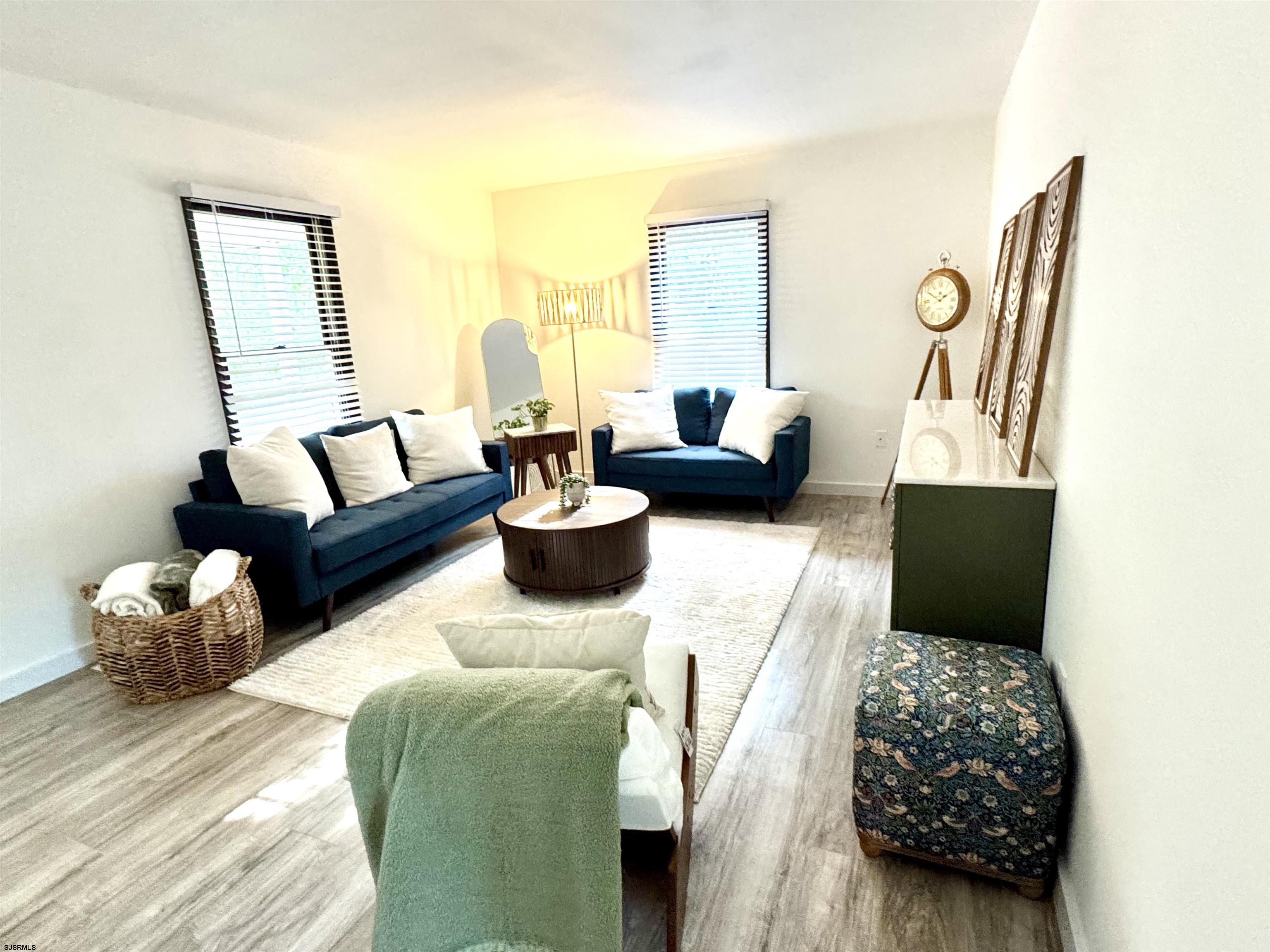 332 Cologne Port Road Port Republic, NJ 08241 - Photo 5 of 20 a living room with furniture rug and lamp