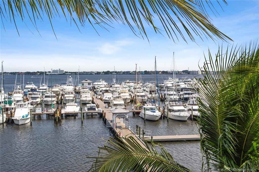 715 Northwest Flagler Avenue, Unit 202 Stuart, FL 34994 - Photo 1 of 26 a view of a chairs and table in the patio