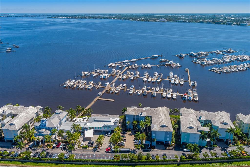 715 Northwest Flagler Avenue, Unit 202 Stuart, FL 34994 - Photo 12 of 26 a view of a lake with a mountain in the background