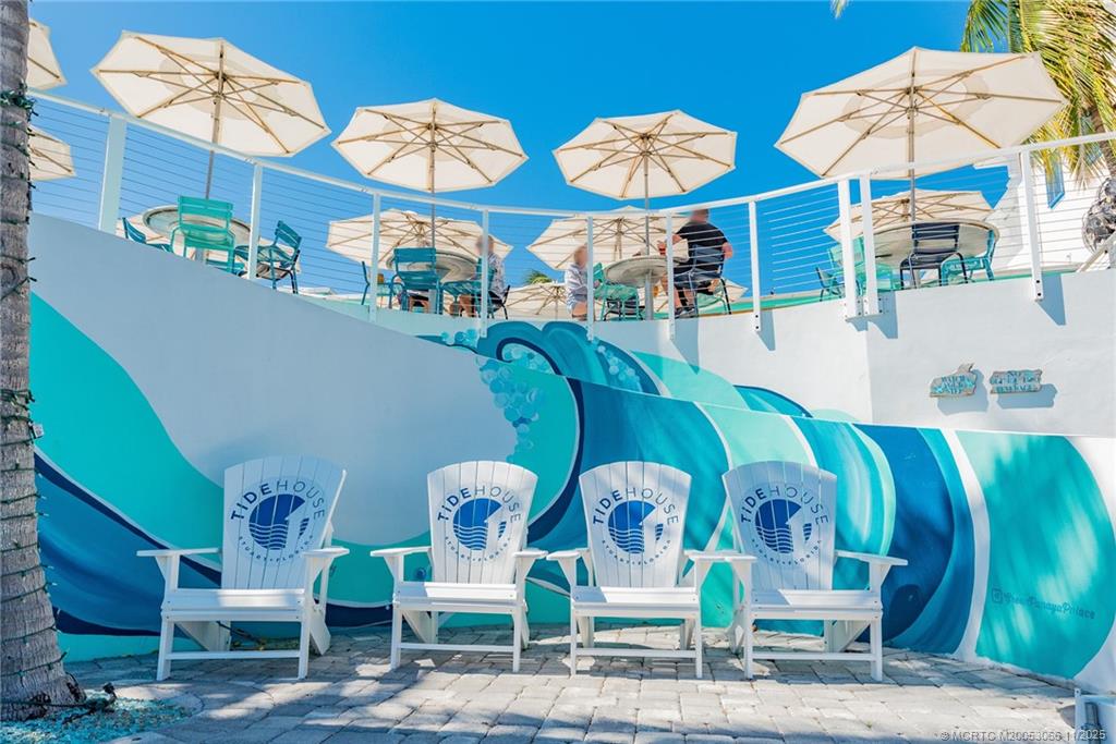 715 Northwest Flagler Avenue, Unit 202 Stuart, FL 34994 - Photo 15 of 26 a view of multiple house with outdoor space