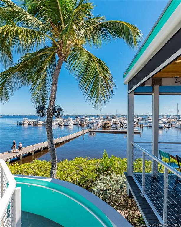 715 Northwest Flagler Avenue, Unit 202 Stuart, FL 34994 - Photo 17 of 26 a view of a backyard and swimming pool