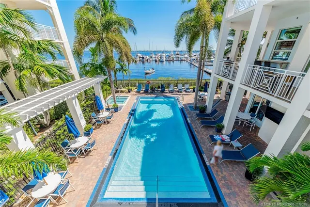 a view of swimming pool with outdoor seating