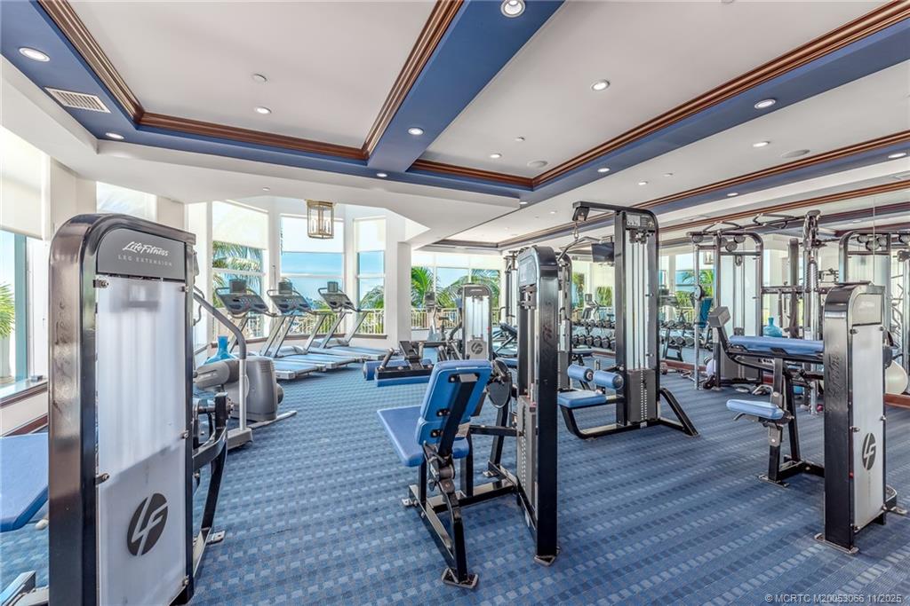 715 Northwest Flagler Avenue, Unit 202 Stuart, FL 34994 - Photo 23 of 26 a view of a room with gym equipment