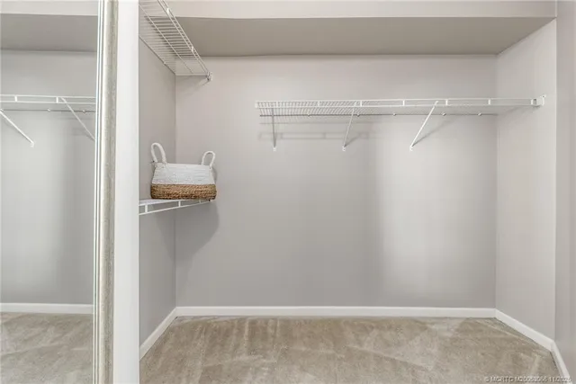a bathroom with a double vanity sink and mirror