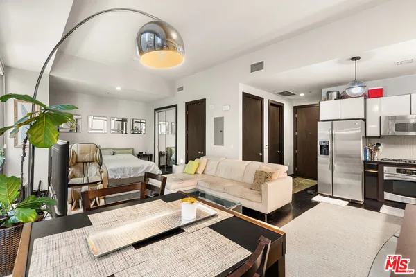 a living room with furniture fireplace and flat screen tv