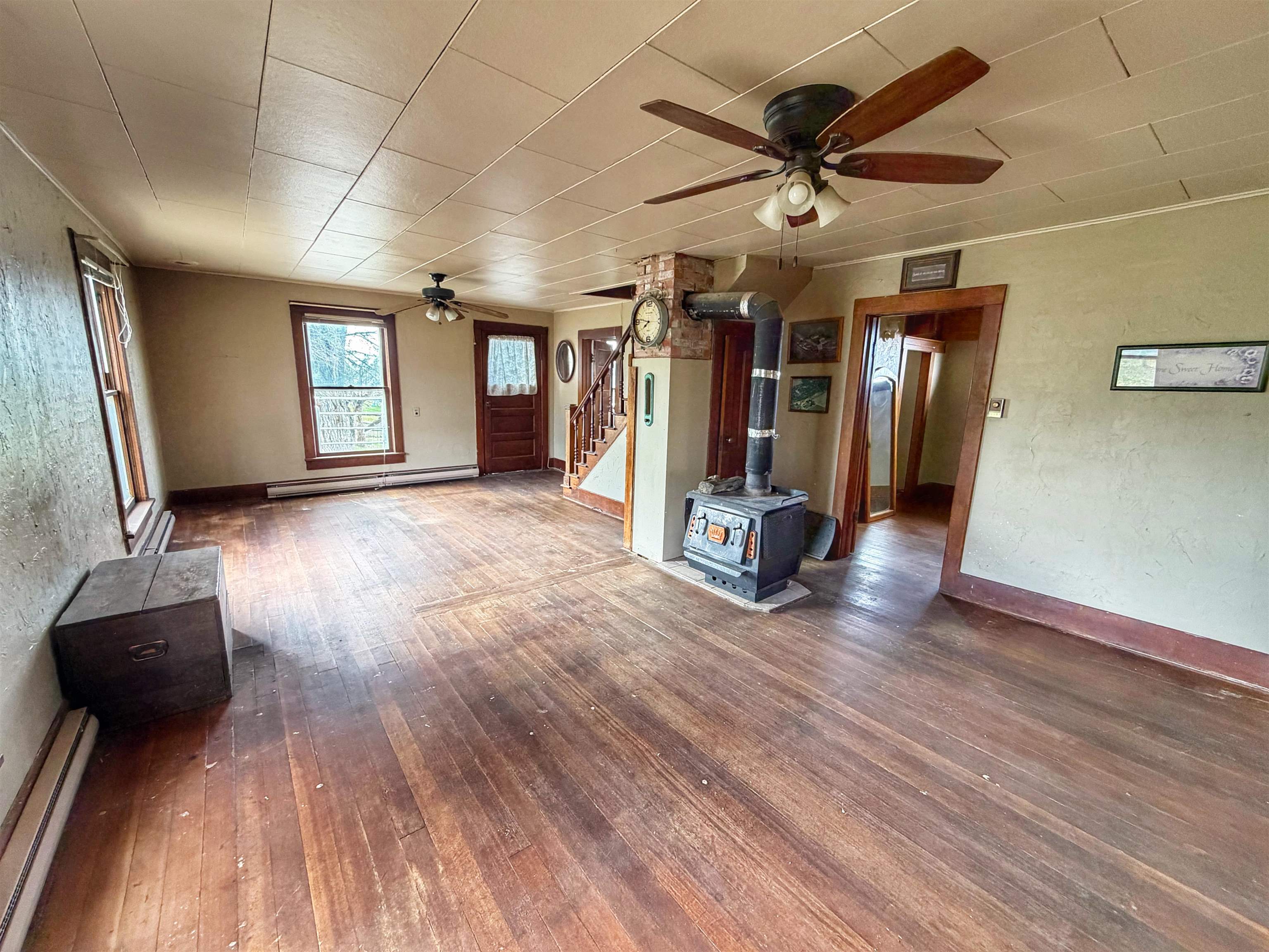 11260 54 7/10 Road Molina, CO 81646 - Photo 9 of 31 a view of a room with wooden floor and a ceiling fan