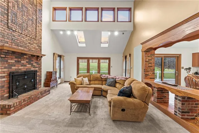 a living room with furniture and fireplace