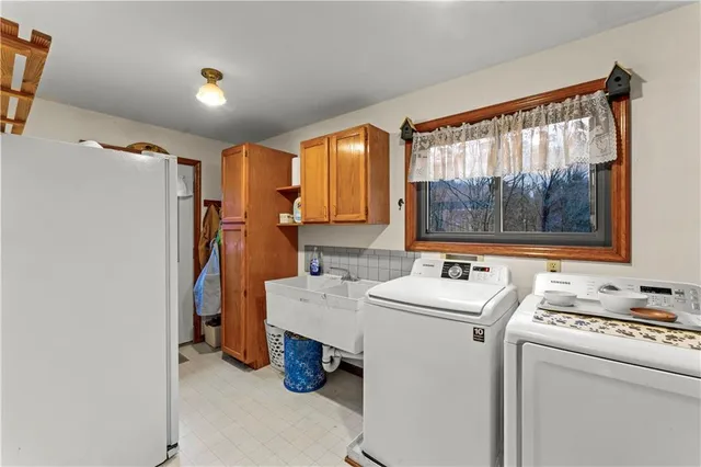 a storage room with washer and dryer