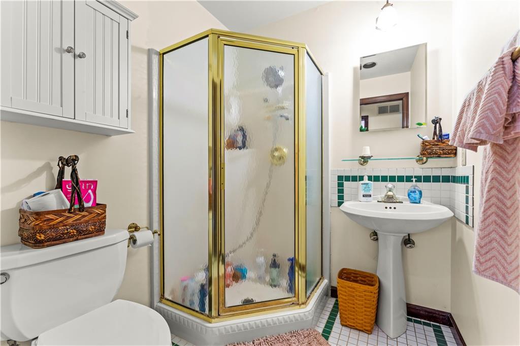 420 Vaneal Road Washington, PA 15301 - Photo 20 of 42 a bathroom with a sink mirror toilet and shower