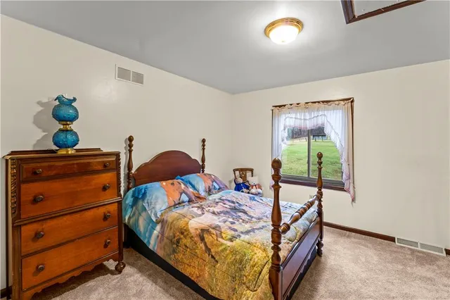 a bed room with a bed and a window