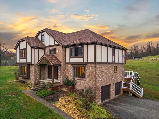 front view of a house with a yard