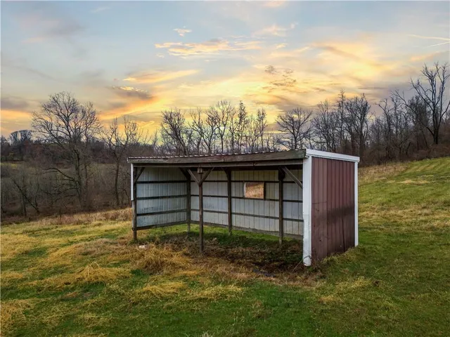 a view of a wooden bridge near a lake