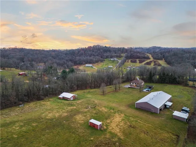 a view of a table and chairs in backyard
