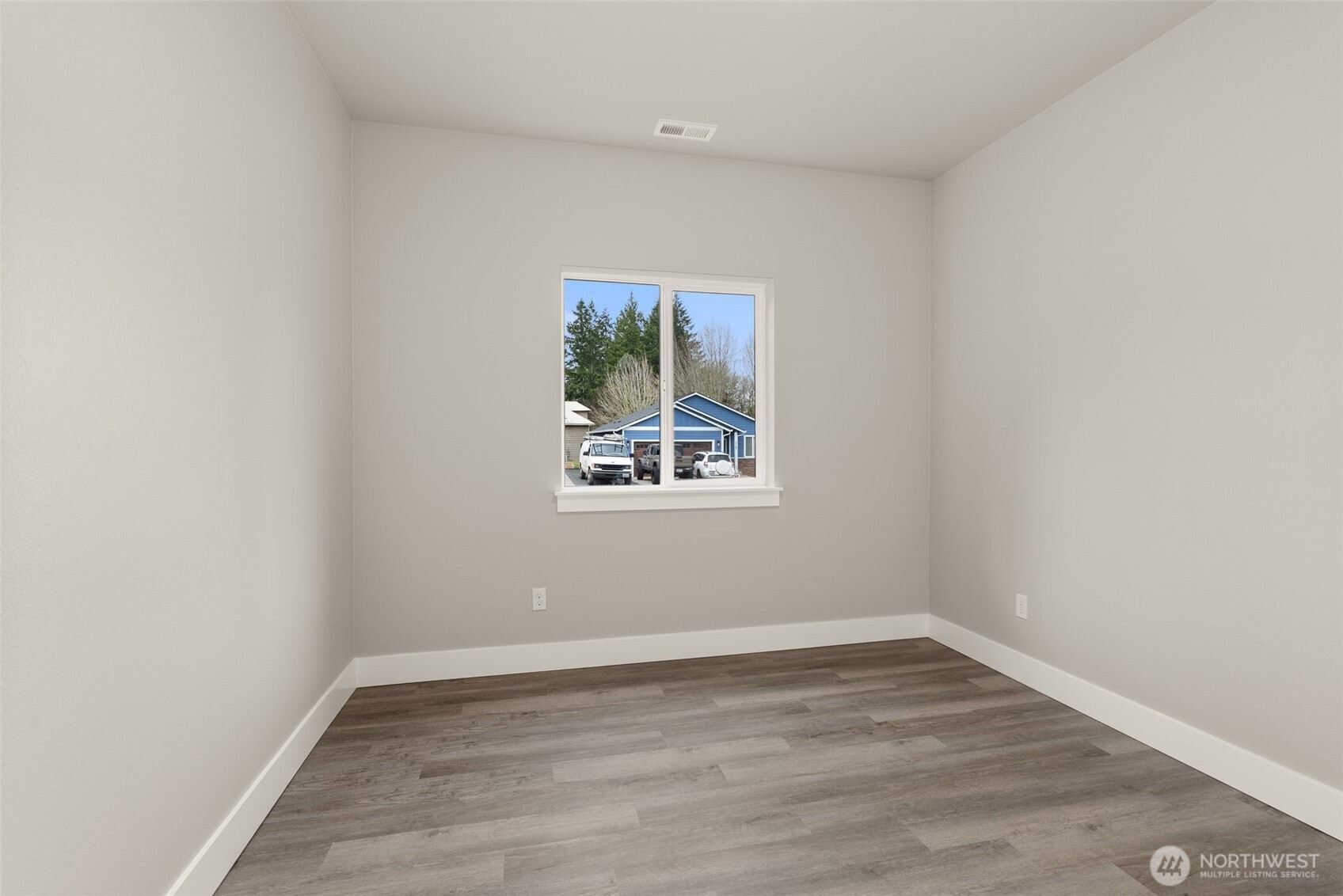 2103 Hawks Vw Lane Winlock, WA 98596 - Photo 11 of 24 wooden floor in an empty room with a window