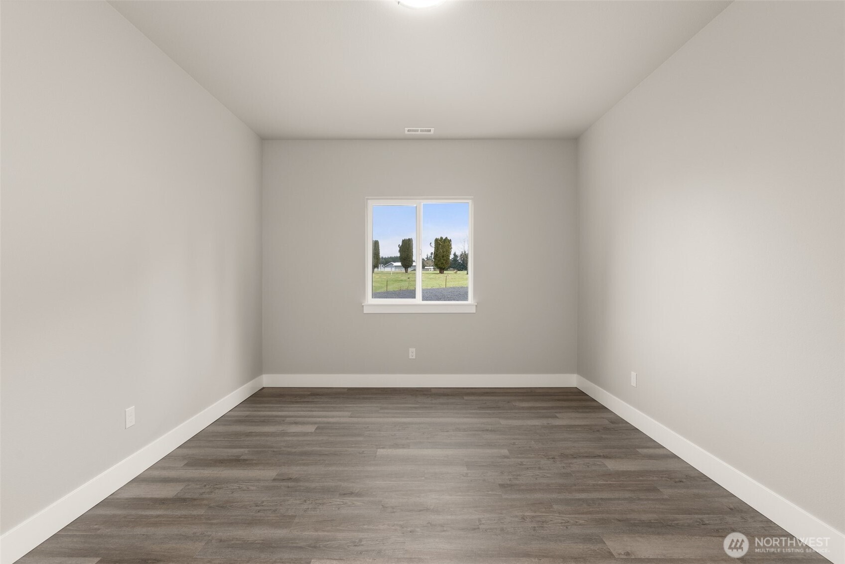 2103 Hawks Vw Lane Winlock, WA 98596 - Photo 8 of 24 wooden floor in an empty room with a window