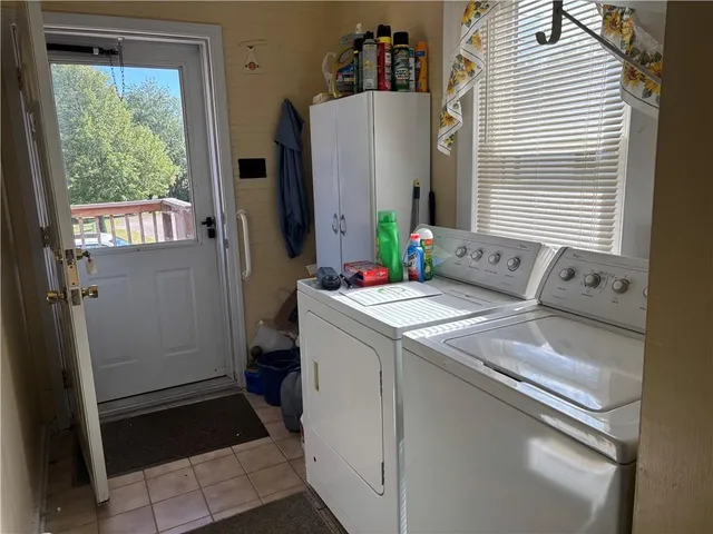 a utility room with dryer and washer
