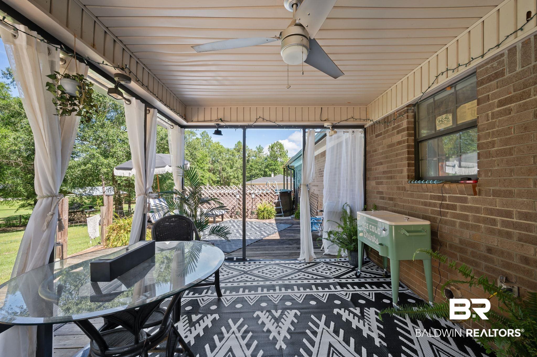 52923 Ammons Road Perdido, AL 36562 - Photo 24 of 35 Sunroom featuring a ceiling fan and outdoor dining space